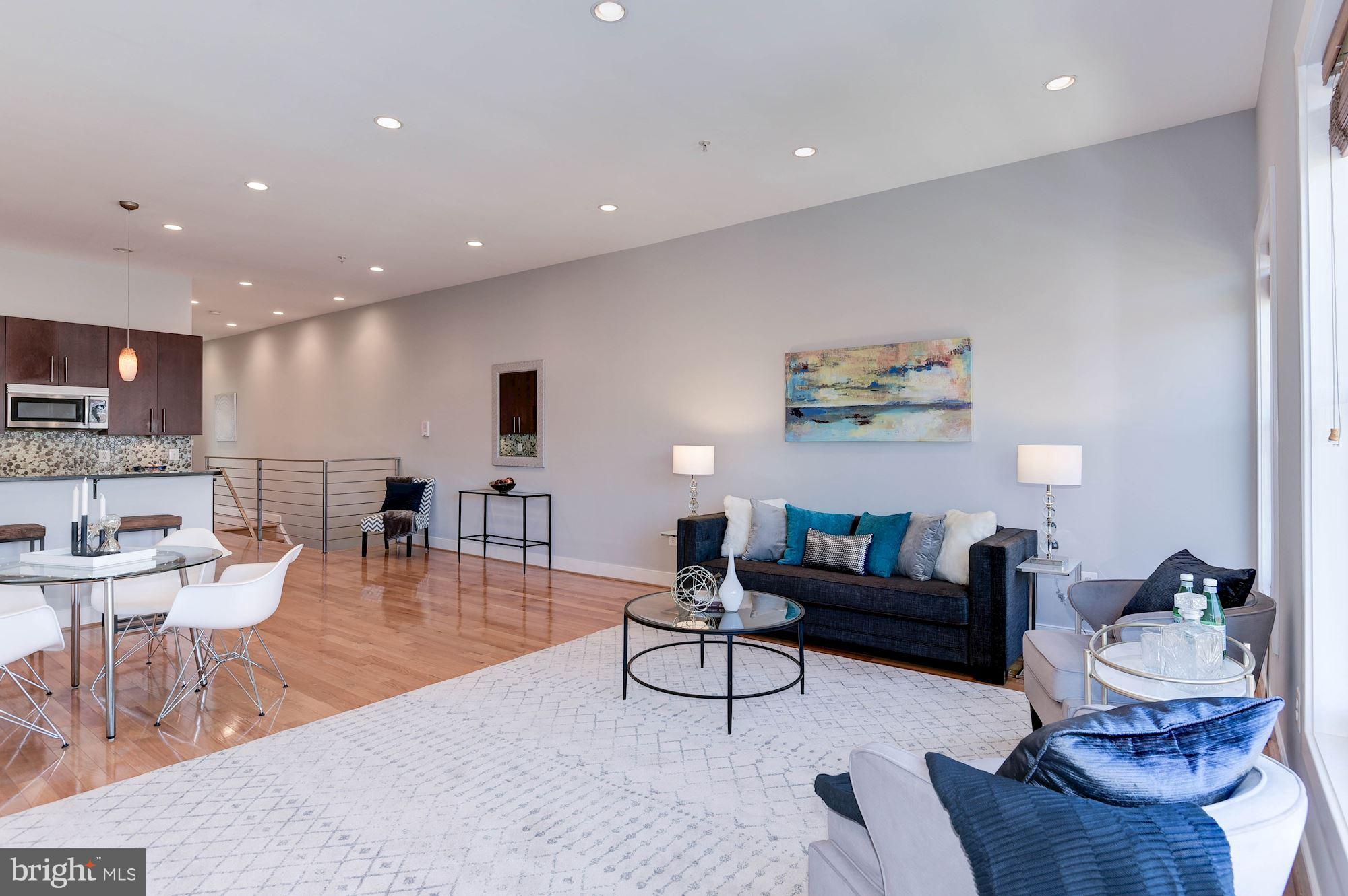2444 Ontario Road Northwest, Unit 4 Washington, DC 20009 - Photo 5 of 26 a living room with furniture and a view of kitchen