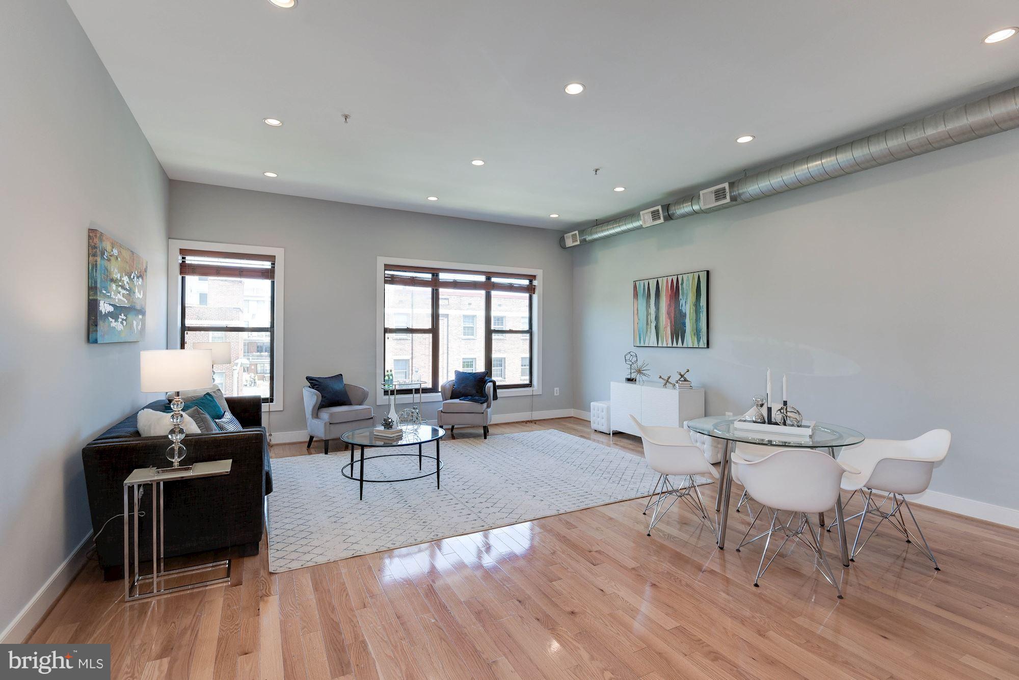 2444 Ontario Road Northwest, Unit 4 Washington, DC 20009 - Photo 7 of 26 a living room with furniture and wooden floor