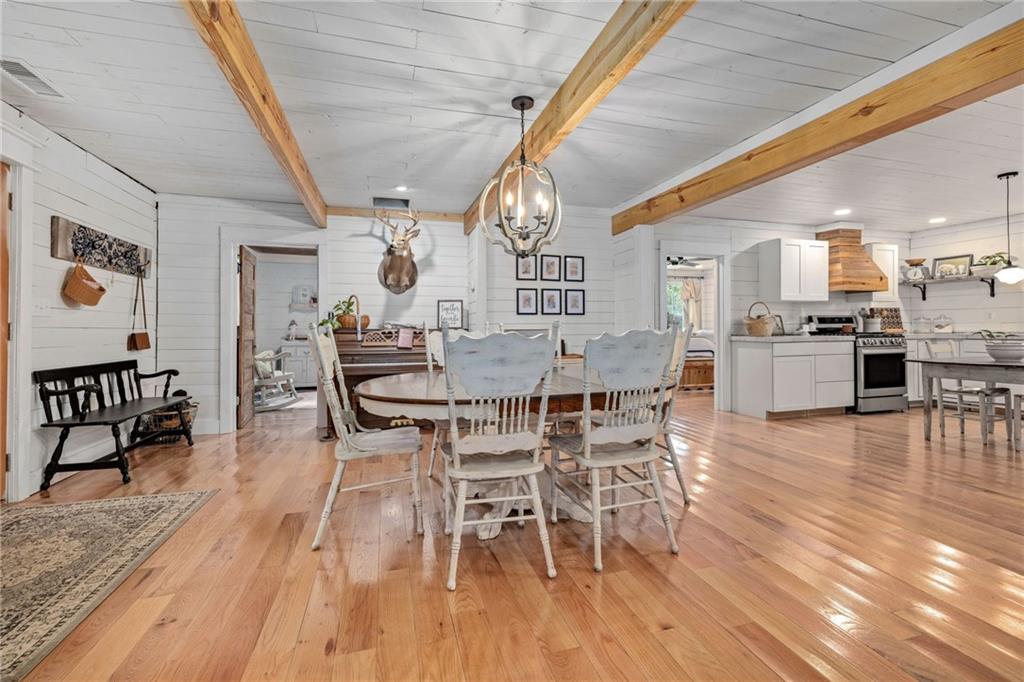 385 Amy's Road Clarkesville, GA 30523 - Photo 14 of 57 a dining room with furniture entryway and wooden floor