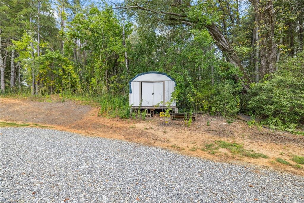 385 Amy's Road Clarkesville, GA 30523 - Photo 40 of 57 a small pool with a big yard and large trees