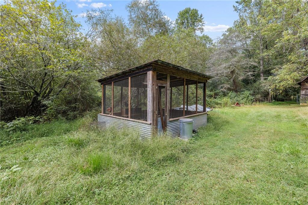 385 Amy's Road Clarkesville, GA 30523 - Photo 42 of 57 a view of a house with a yard