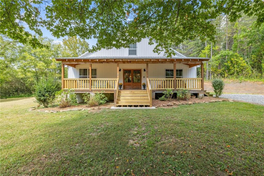 385 Amy's Road Clarkesville, GA 30523 - Photo 6 of 57 front view of a house with a big yard
