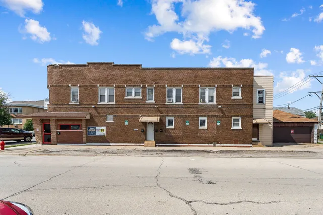 a front view of a building with a road