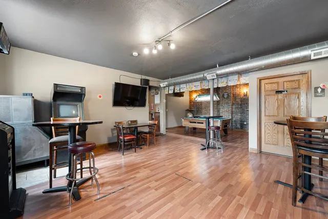 a view of a livingroom with furniture and a flat screen tv