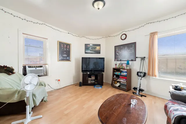 a room with furniture and a flat screen tv