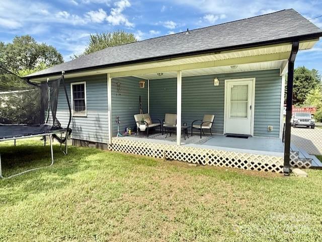 114 Yates Street Dallas, NC 28034 - Photo 12 of 41 a backyard of a house with table and chairs
