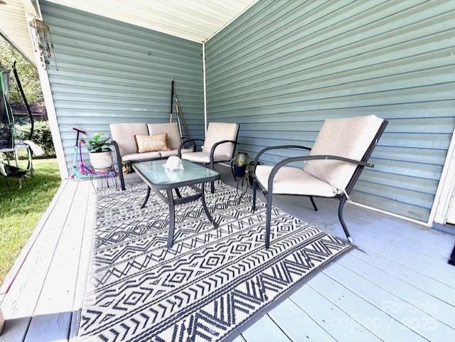 114 Yates Street Dallas, NC 28034 - Photo 14 of 41 a backyard of a house with table and chairs