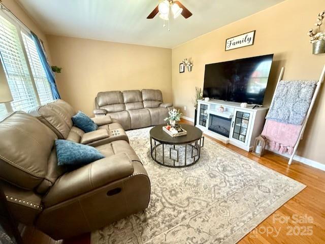 114 Yates Street Dallas, NC 28034 - Photo 16 of 41 a living room with furniture and a flat screen tv