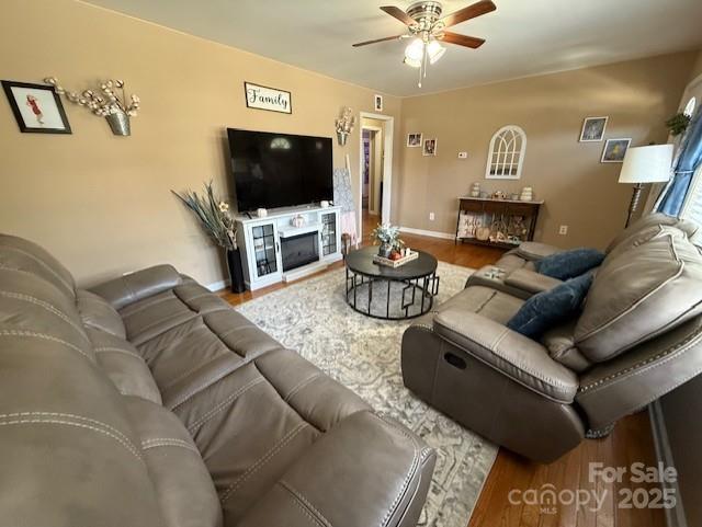 114 Yates Street Dallas, NC 28034 - Photo 18 of 41 a living room with furniture and a flat screen tv