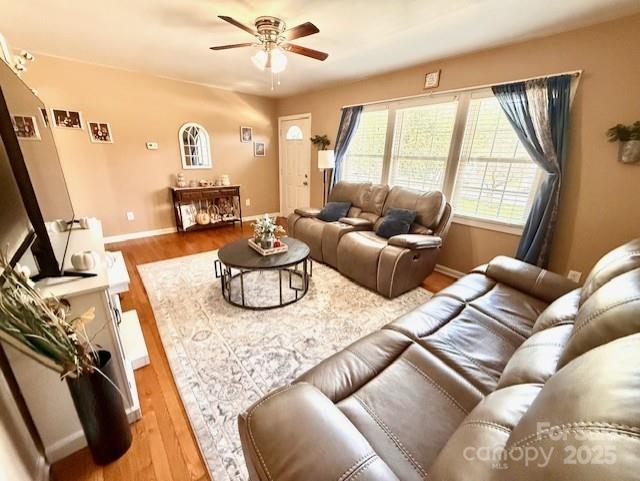 114 Yates Street Dallas, NC 28034 - Photo 19 of 41 a living room with furniture and a large window