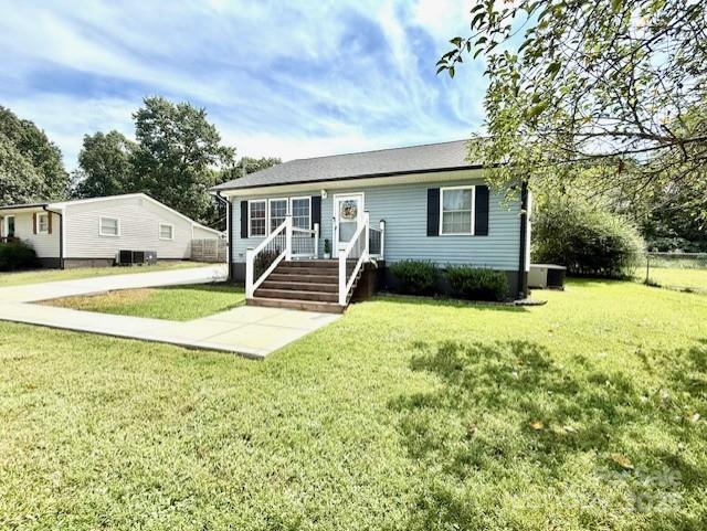 114 Yates Street Dallas, NC 28034 - Photo 2 of 41 a view of a house with backyard and a tree