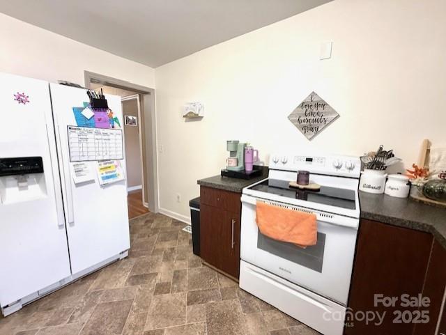 114 Yates Street Dallas, NC 28034 - Photo 25 of 41 a kitchen with stainless steel appliances granite countertop a refrigerator and a stove
