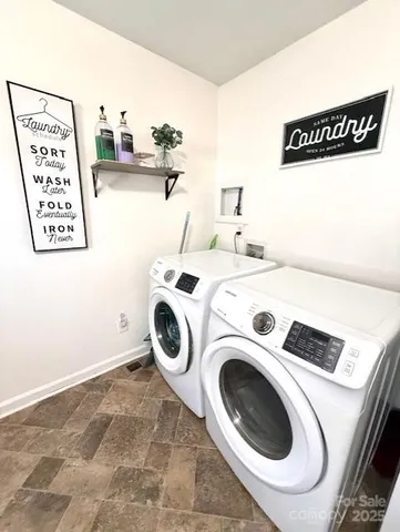 a kitchen with a sink a stove a microwave and cabinets