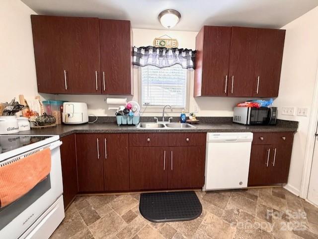 114 Yates Street Dallas, NC 28034 - Photo 28 of 41 a kitchen with a sink a stove a microwave and cabinets