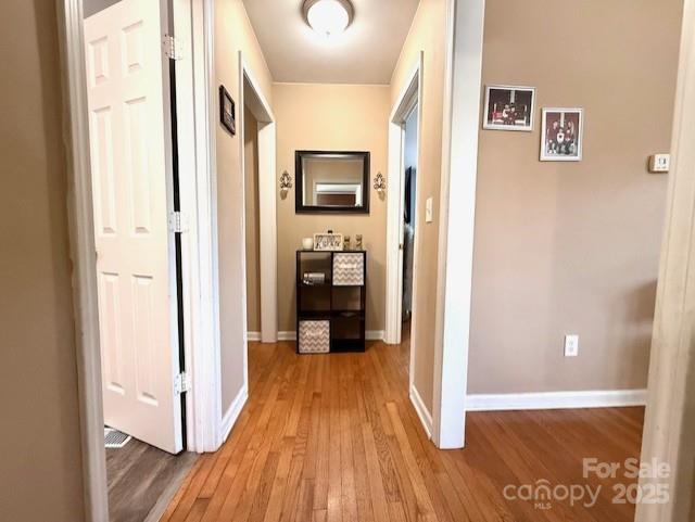 114 Yates Street Dallas, NC 28034 - Photo 29 of 41 a view of a hallway with wooden floor and living room