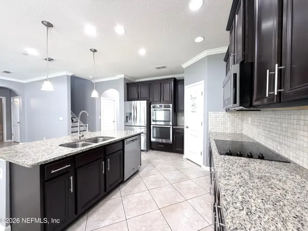 a view of an empty room and wooden floor