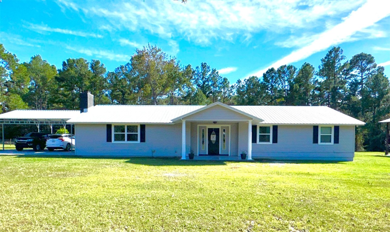 2707 Jane Lane Hilliard, FL 32046 - Photo 1 of 26 a front view of a house with swimming pool