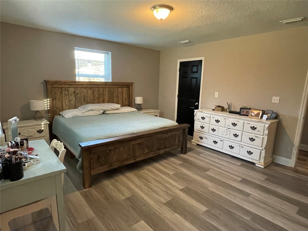 2707 Jane Lane Hilliard, FL 32046 - Photo 11 of 26 a bedroom with a bed and a dresser