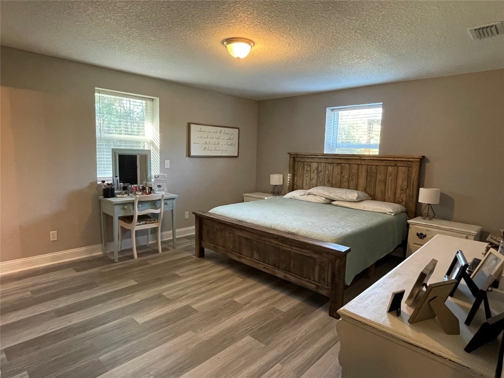 2707 Jane Lane Hilliard, FL 32046 - Photo 12 of 26 a bedroom with a bed and a window