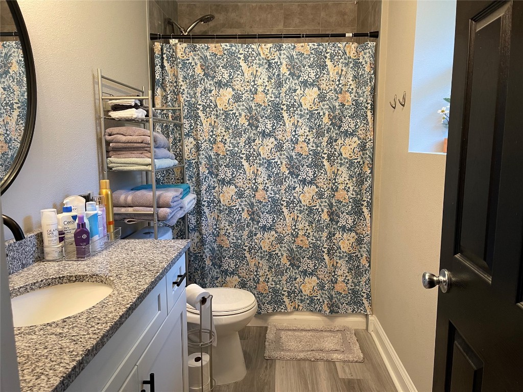 2707 Jane Lane Hilliard, FL 32046 - Photo 14 of 26 a bathroom with a granite countertop toilet sink and mirror