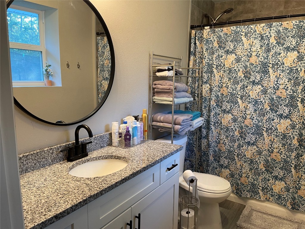2707 Jane Lane Hilliard, FL 32046 - Photo 15 of 26 a bathroom with a granite countertop sink and a mirror