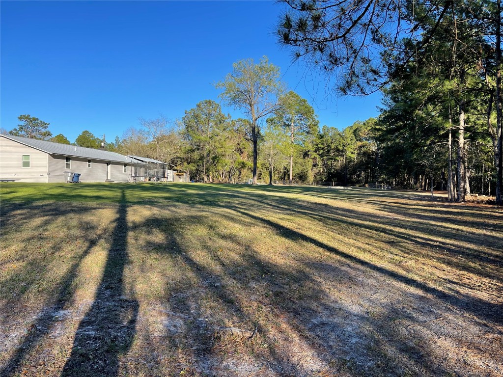 2707 Jane Lane Hilliard, FL 32046 - Photo 24 of 26 a view of a yard in front of a house