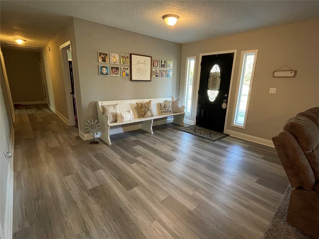 2707 Jane Lane Hilliard, FL 32046 - Photo 3 of 26 a view of a livingroom with furniture and wooden floor
