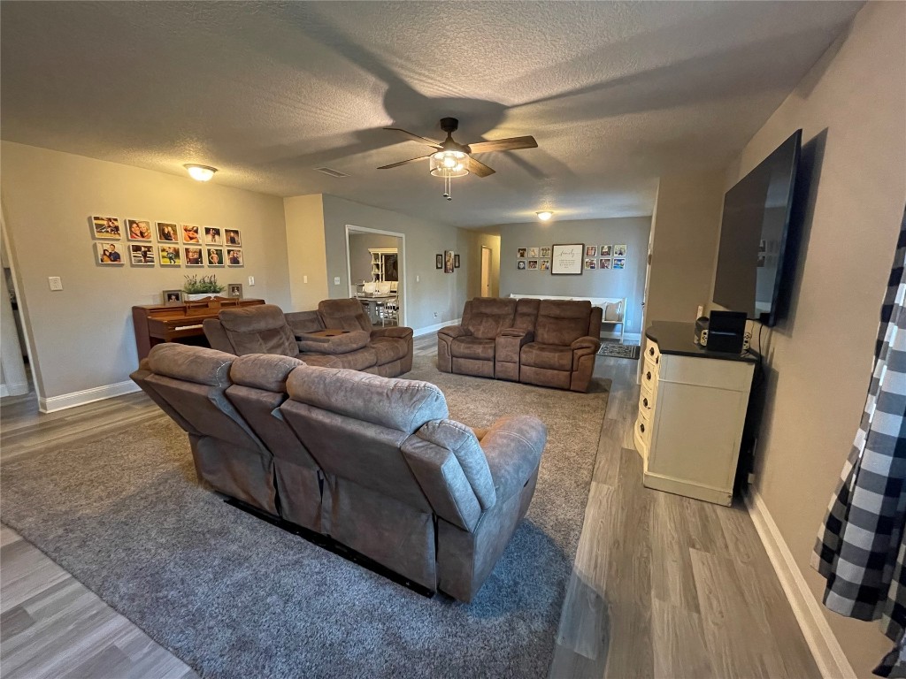 2707 Jane Lane Hilliard, FL 32046 - Photo 4 of 26 a living room with furniture and a flat screen tv