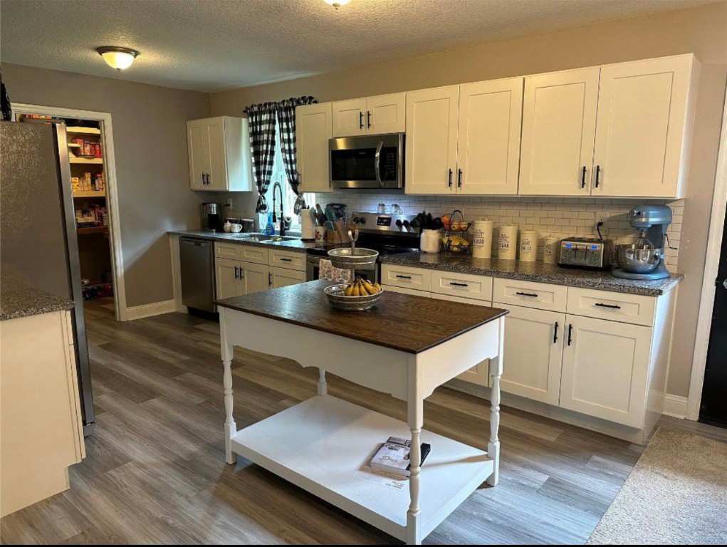 2707 Jane Lane Hilliard, FL 32046 - Photo 6 of 26 a kitchen with a sink stove and refrigerator