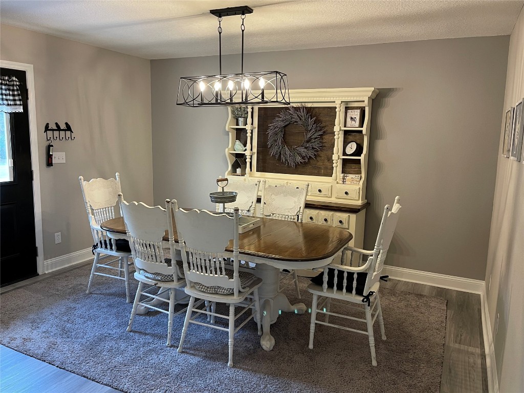 2707 Jane Lane Hilliard, FL 32046 - Photo 7 of 26 a view of a dining room with furniture and chandelier