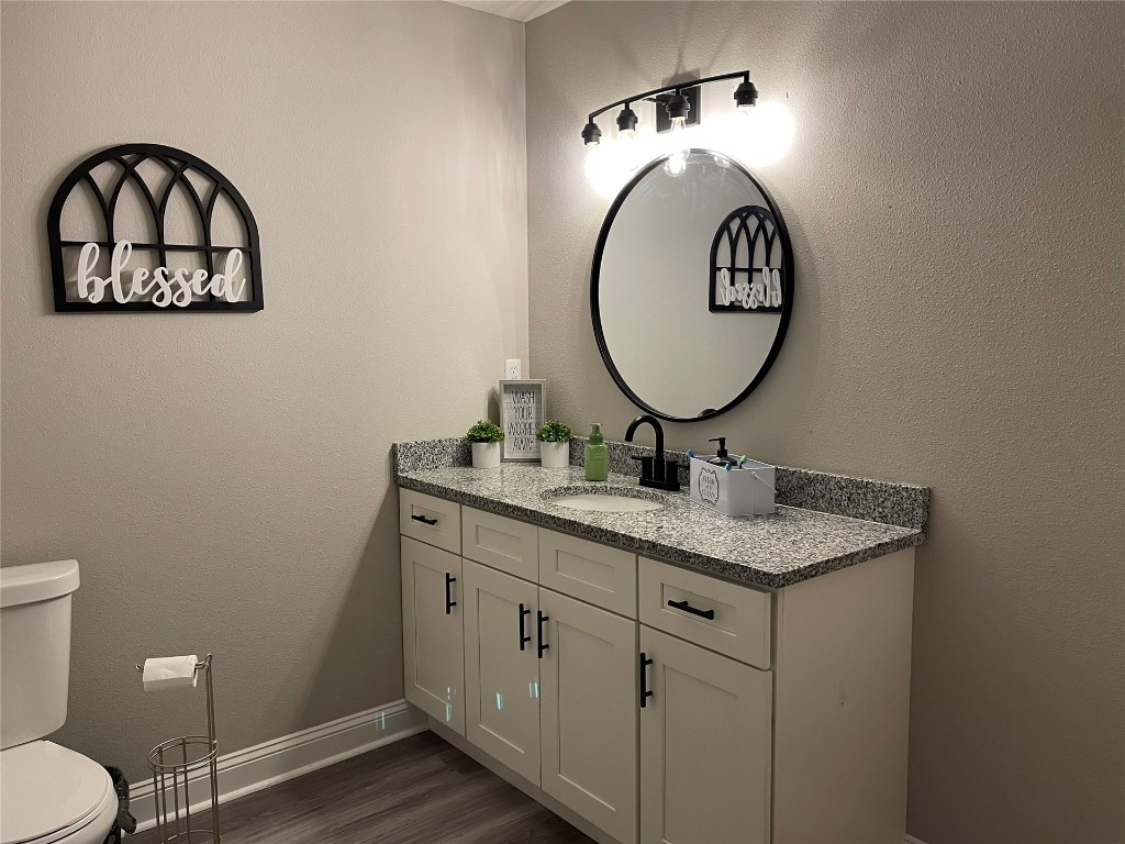 2707 Jane Lane Hilliard, FL 32046 - Photo 9 of 26 a bathroom with a toilet a sink and a mirror