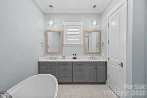 a bathroom with a granite countertop sink toilet and mirror