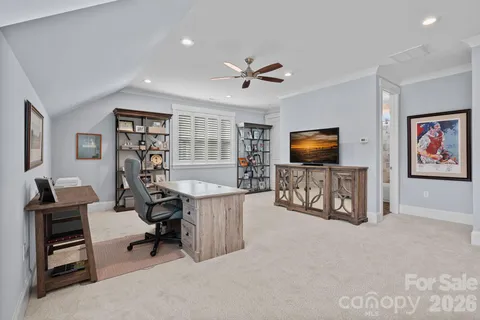 a view of a livingroom with furniture and a flat screen tv