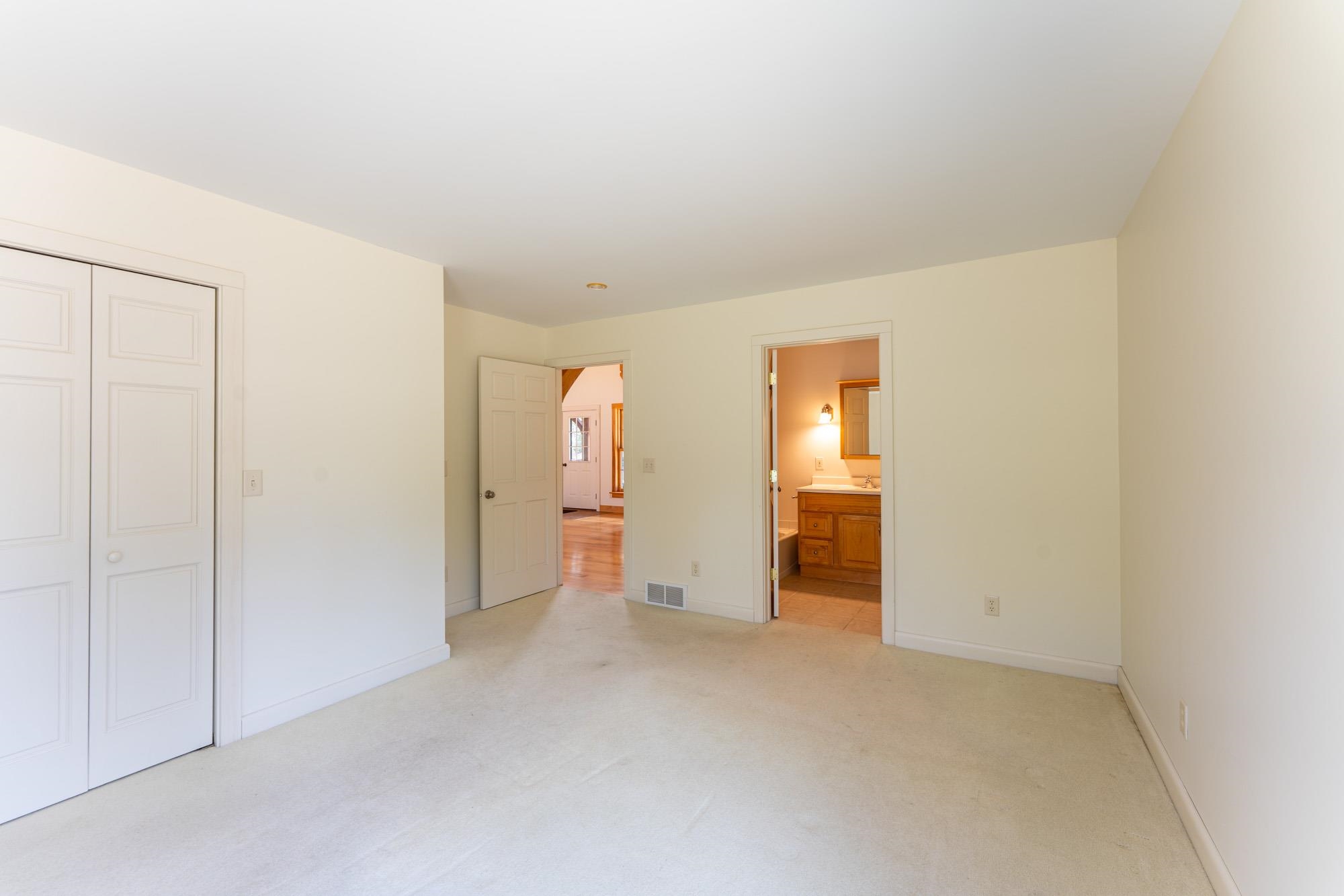 2263 Longstorff Road Ely, MN 55731 - Photo 12 of 49 Unfurnished bedroom with visible vents, baseboards, a closet, and light colored carpet