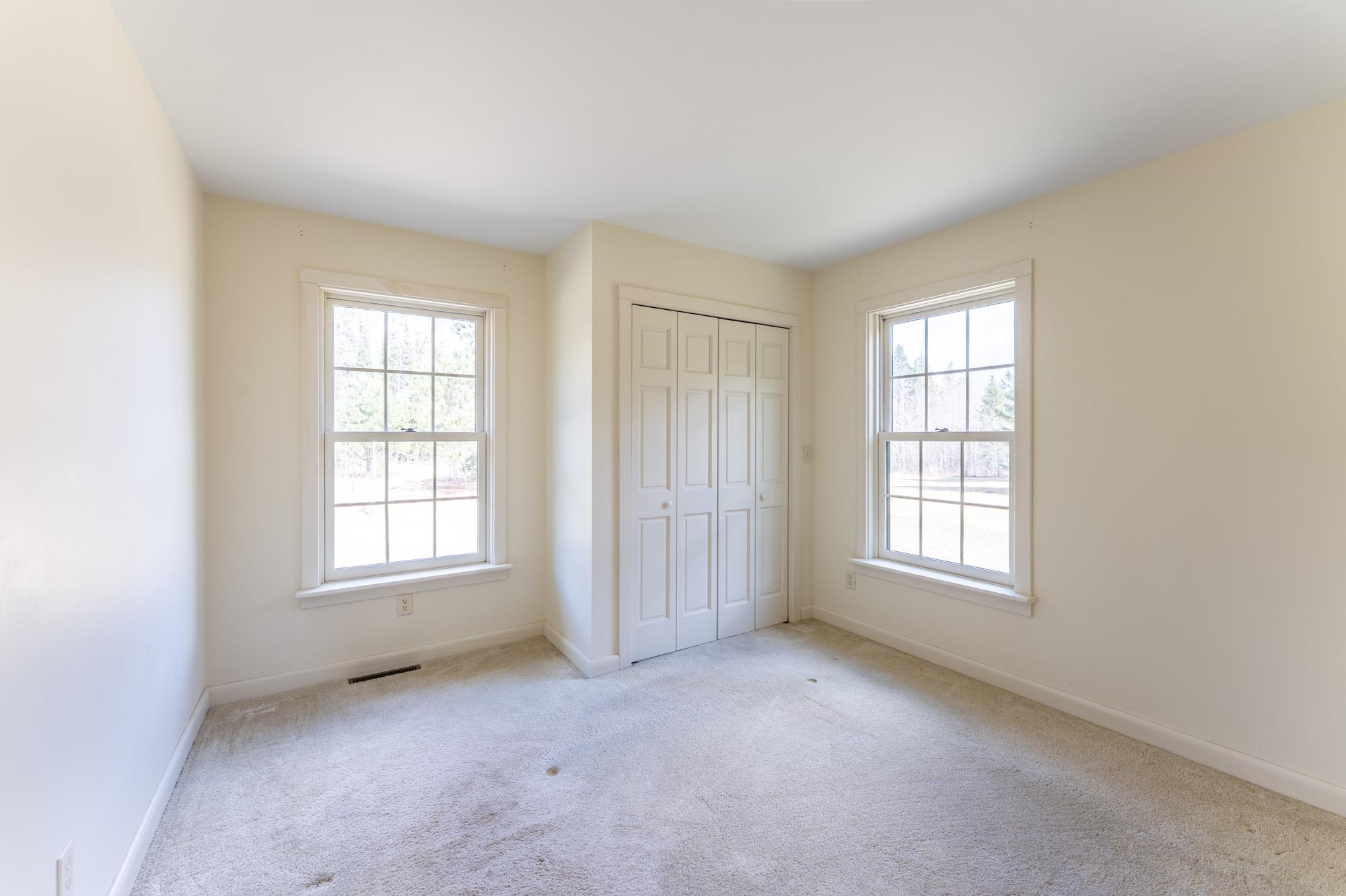 2263 Longstorff Road Ely, MN 55731 - Photo 14 of 49 Unfurnished bedroom with a closet, baseboards, carpet flooring, and visible vents