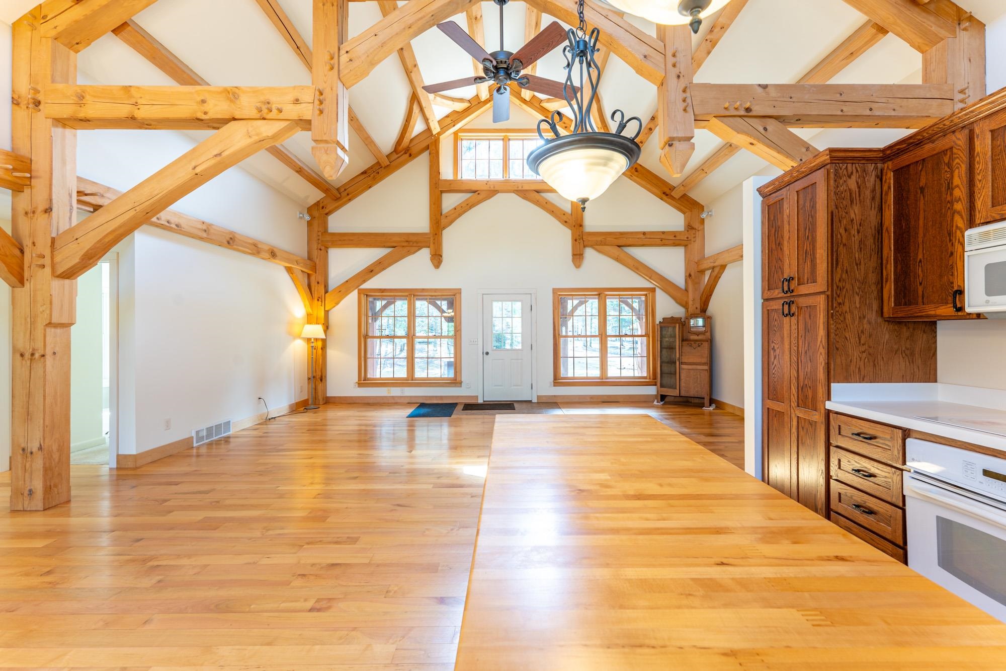2263 Longstorff Road Ely, MN 55731 - Photo 49 of 49 Kitchen with ceiling fan, white appliances, high vaulted ceiling, open floor plan, and visible vents