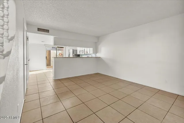 a view of a kitchen with a sink and cabinet