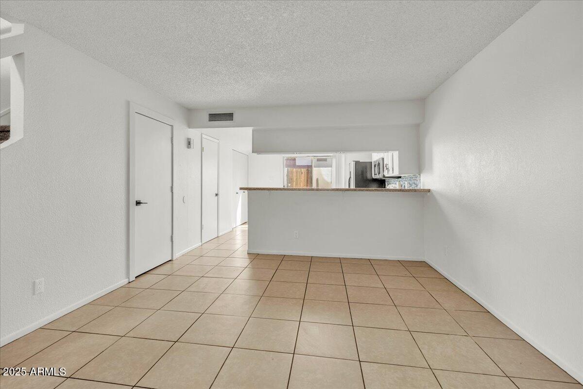 2437 East Tracy Lane, Unit 2 Phoenix, AZ 85032 - Photo 13 of 30 a view of a kitchen with a sink and cabinet
