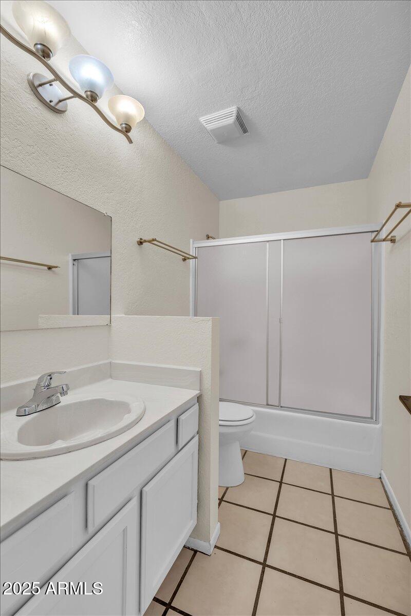 2437 East Tracy Lane, Unit 2 Phoenix, AZ 85032 - Photo 17 of 30 a bathroom with a sink toilet and vanity