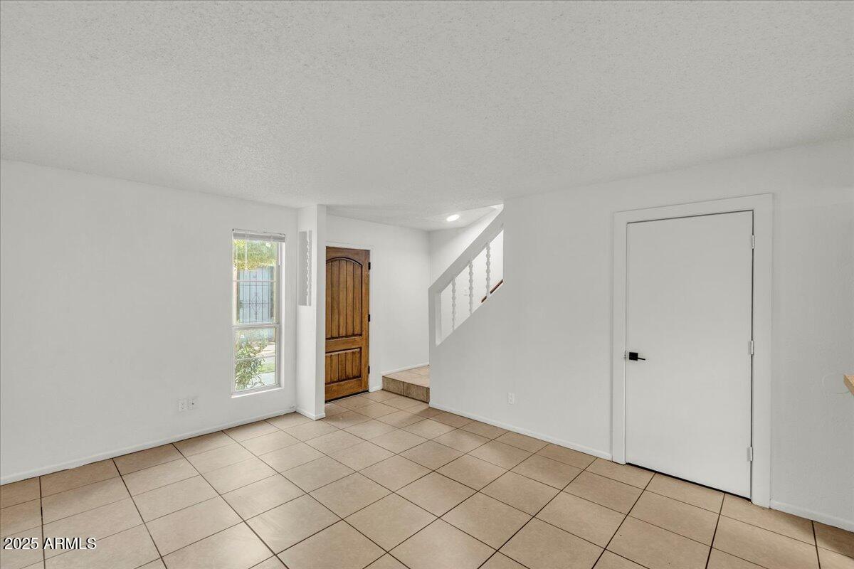 2437 East Tracy Lane, Unit 2 Phoenix, AZ 85032 - Photo 25 of 30 a view of an empty room with window