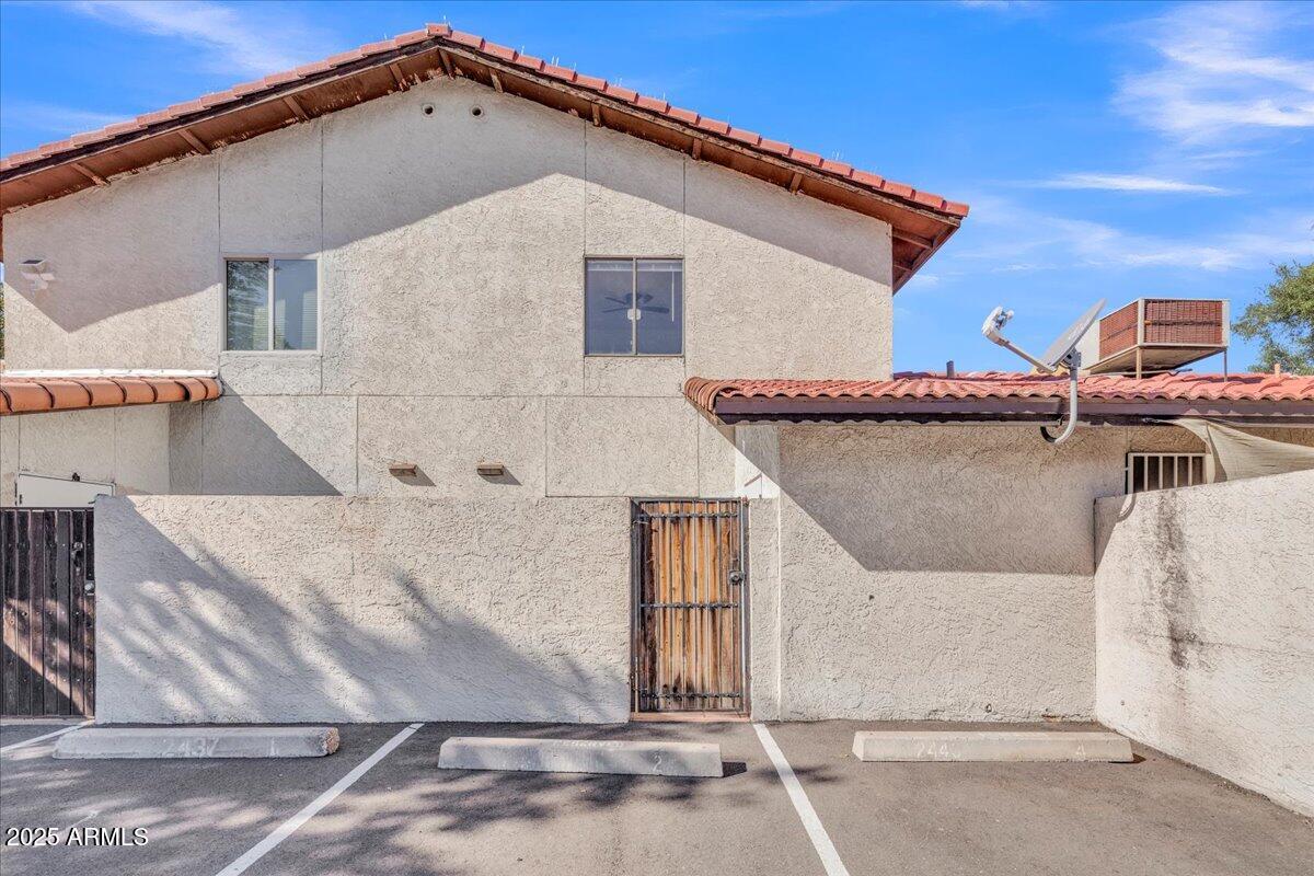 2437 East Tracy Lane, Unit 2 Phoenix, AZ 85032 - Photo 29 of 30 a view of a house with a patio