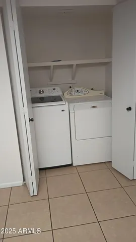 a utility room with washer and dryer