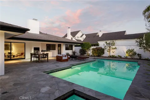 a view of a patio with swimming pool table and chairs