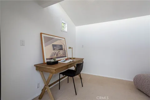 a view of a workspace with furniture