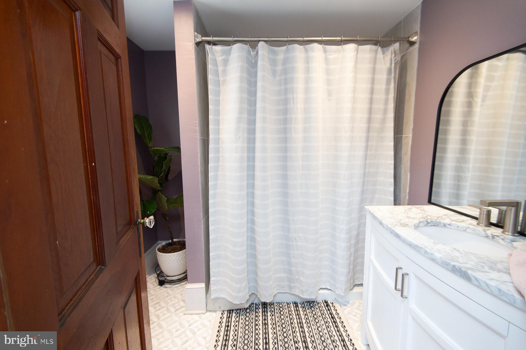 3755 Sunnyside Road East New Market, MD 21631 - Photo 17 of 37 a bathroom with a sink and a mirror