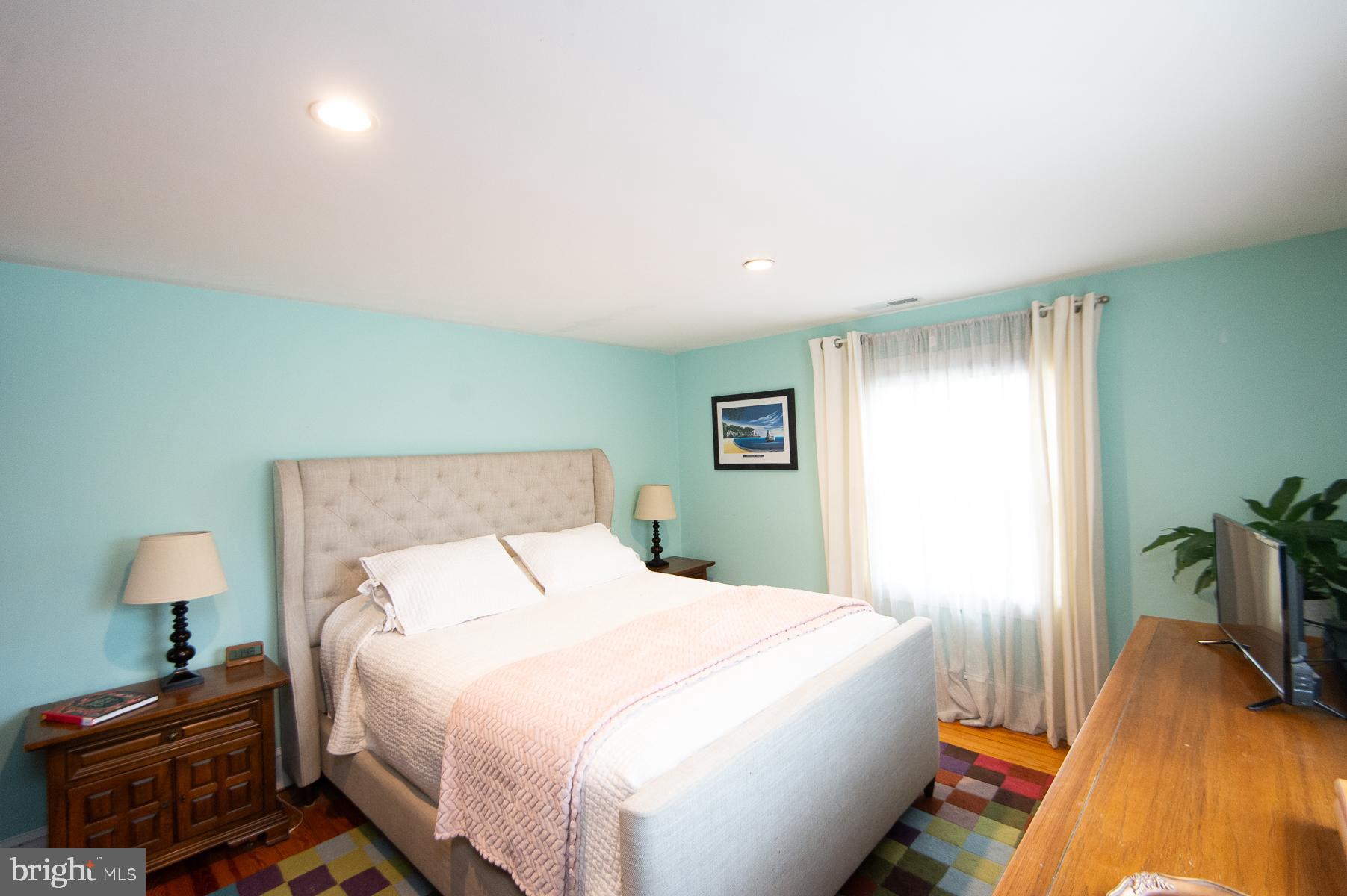 3755 Sunnyside Road East New Market, MD 21631 - Photo 18 of 37 a bedroom with a bed and a lamp