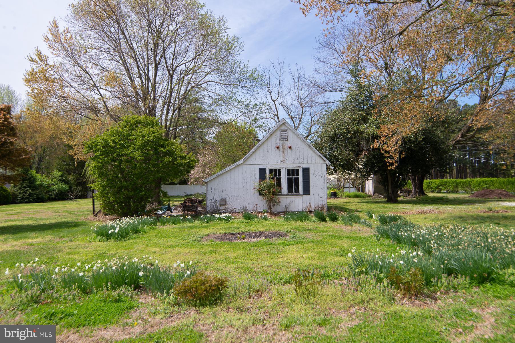 3755 Sunnyside Road East New Market, MD 21631 - Photo 32 of 37 a front view of a house with yard and green space