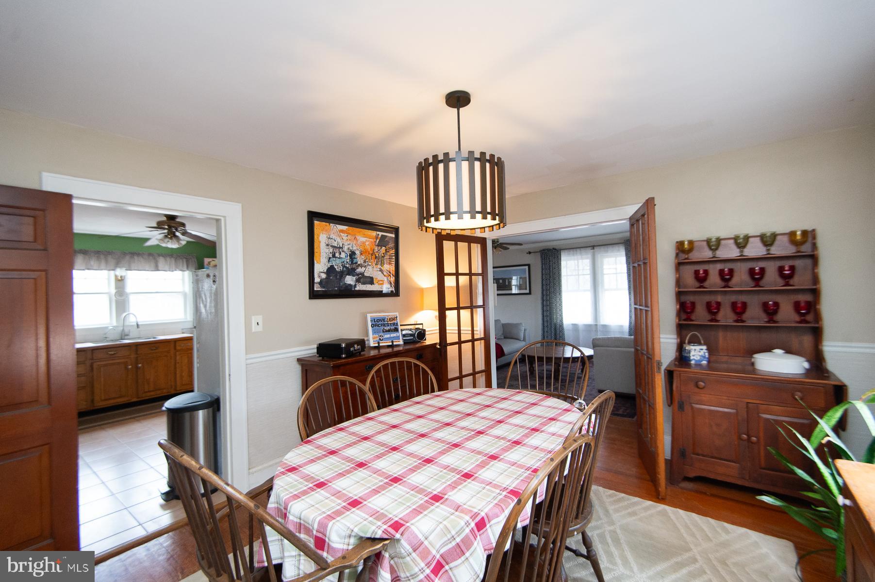 3755 Sunnyside Road East New Market, MD 21631 - Photo 10 of 37 a view of a dining room with furniture window and wooden floor