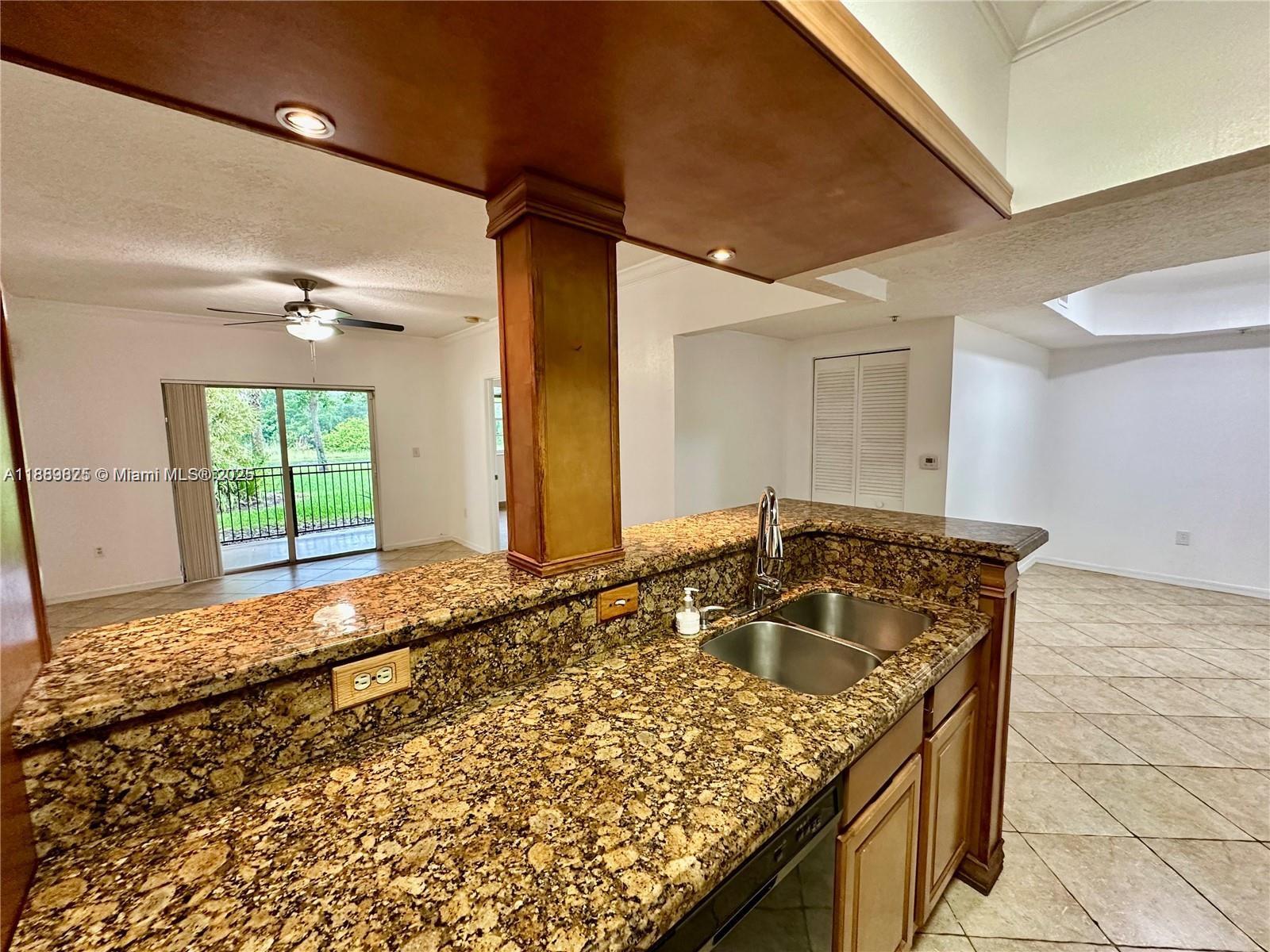 231 Southwest 116th Avenue, Unit 19108 Pembroke Pines, FL 33025 - Photo 12 of 56 a bathroom with a granite countertop sink and a large mirror