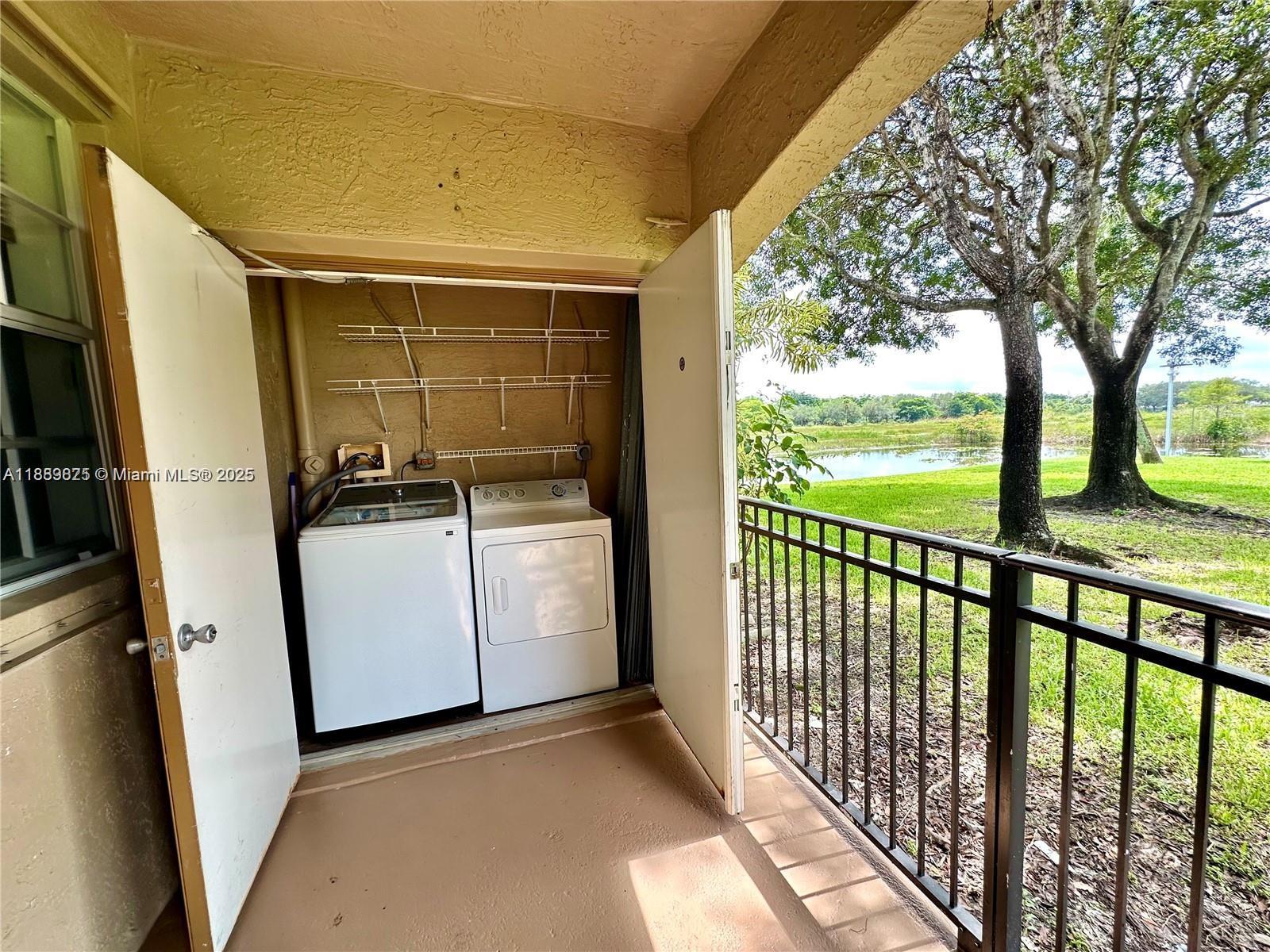 231 Southwest 116th Avenue, Unit 19108 Pembroke Pines, FL 33025 - Photo 15 of 56 a view of a room with washer and dryer